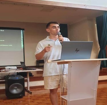 Travis speaking at the podium during a church teaching session.