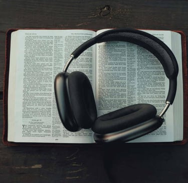 Open Bible showing Psalms 91–92 with headphones resting on its pages.