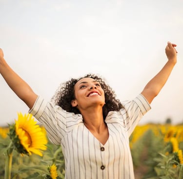 a woman with her arms up and arms up in the air