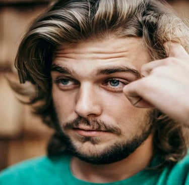 Thoughtful young man looking uncertain and deep in reflection