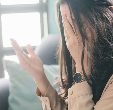 a woman raising her hand in desperation