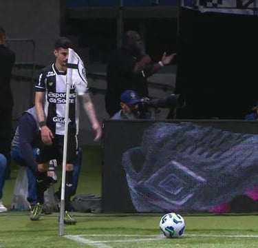 a soccer player is playing soccer on a field