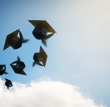 Graduates-hands-throwing-graduation-hats