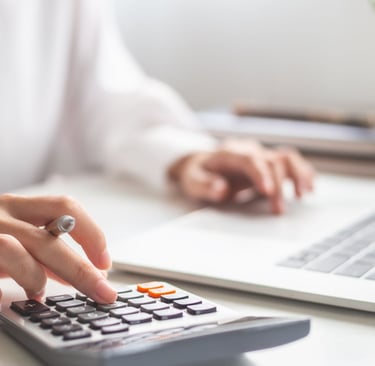 Accountant calculating what revenue they could generate with referring home loan leads to Cromeloan