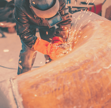 man welding gas pipeline