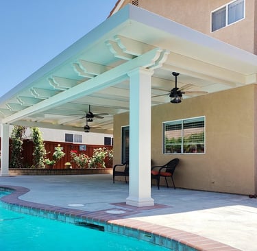 Large white covered patio next to pool.