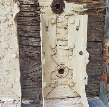 Wood Ledger rotted under steel joist hangers.