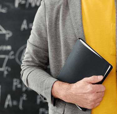 Man holding a notebook at his side, symbolizing ADHD, working memory struggles