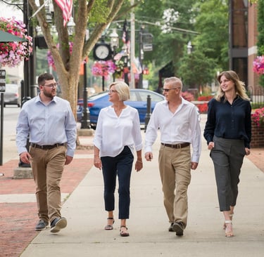 the ogle team walking down broadway in grove city ohio