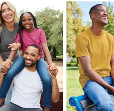 a man and woman sitting on a bench in a park