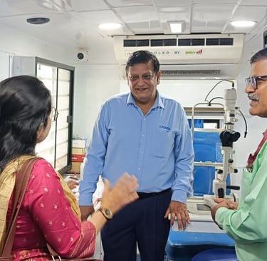 An Ophthalmologist interacting with a patient inside the Mobile Van