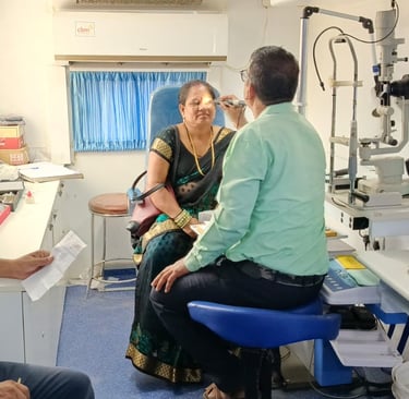 Ophthalmic Technician examining a Patient inside Mobile Van
