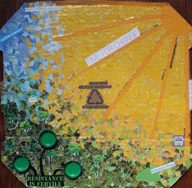Eco-friendly collage made from recycled materials depicting a bright sun and green landscape.