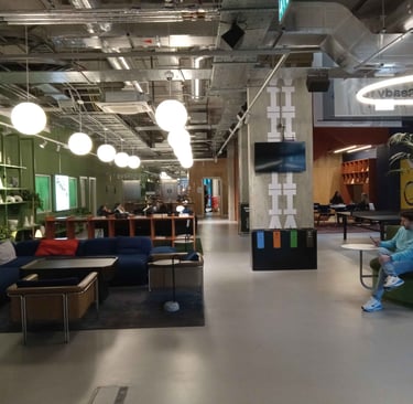 The lobby gathering space at the Social Hub, with lots of couches and plants