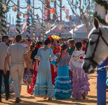 Feria de Abril in Sevilla, a group of people in colorful dresses and hats