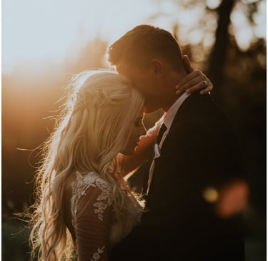 Couple kissing in retro vintage photo booth at Bakersfield wedding