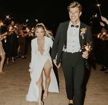 Bride and groom holding hands during wedding ceremony