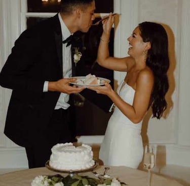 Couple cutting their wedding cake together