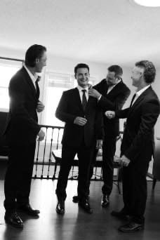 Groom getting ready with friends