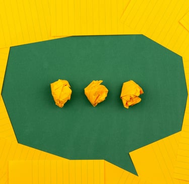 green text bubble on a yellow card background