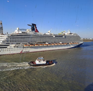 A cruise ship in background with a tugboat in foreground