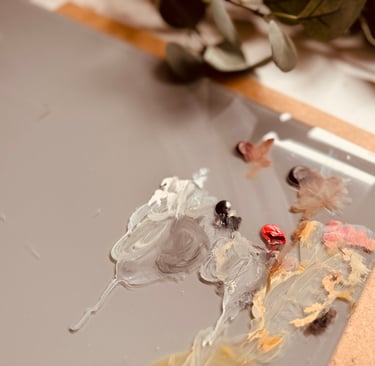 The grey glass palette I use in my painting process