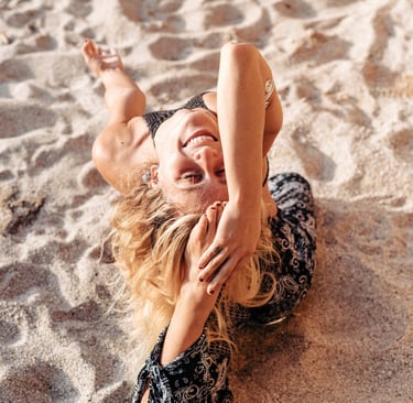 a woman in a black dress doing yoga