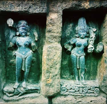 two statues of a woman yogini