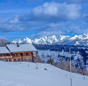 a house with a mountain view of a cabin