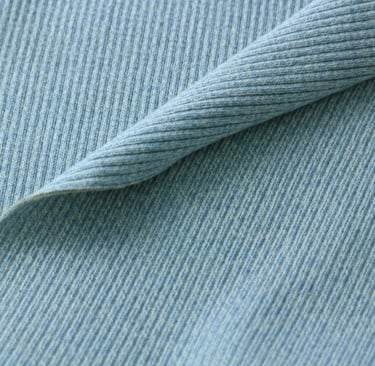 a close up of a blue and white ribbing fabric
