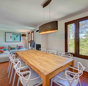 a dining room table with chairs and a couch