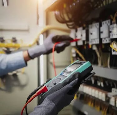 a man in gloves and gloves holding a multi - function metered metered meter