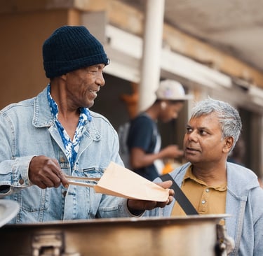 Street vendor in Rodrigues serving food to a customer