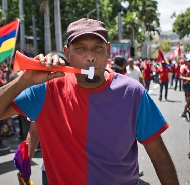 Participant blowing a vuvuzela during the celebration