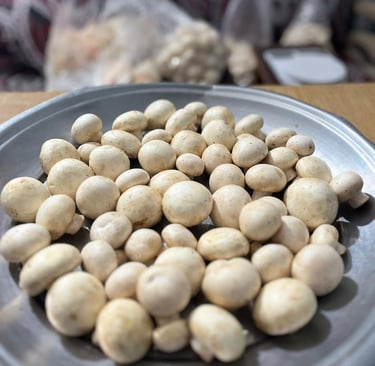 a plate of mushrooms and mushrooms on a table