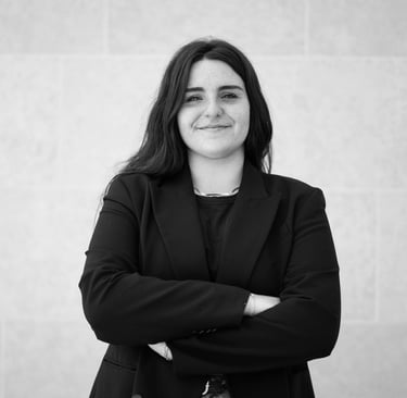 a woman in a black suit and a black and white photo