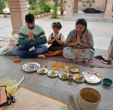 A young family participating in the Matrugaya Pooja at Siddhpur