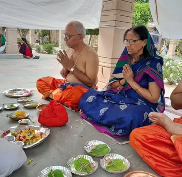A couple performing Matrugaya Pooja at Siddhpur’s sacred Bindu Sarovar, offering pind daan rituals f