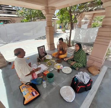 Yajaman couple performing Matrugaya Shraddh Pooja with departed mother's photograph at Bindu Sarovar Siddhpur