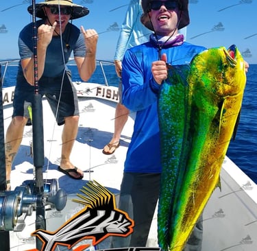 a man holding a fish on a boat