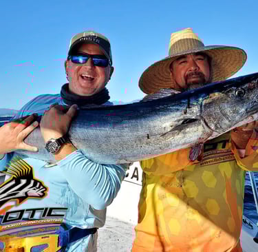 a man and a woman holding a fish