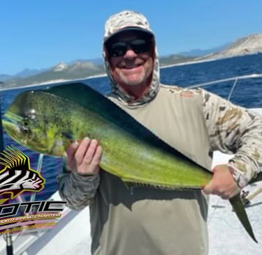a man holding a fish on a boat