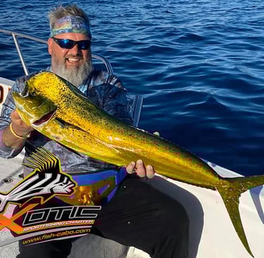 a man holding a fish on a boat