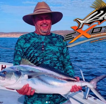 a man in a hat and a hat holding a fish