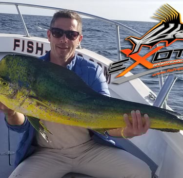 a man holding a fish fish on a boat