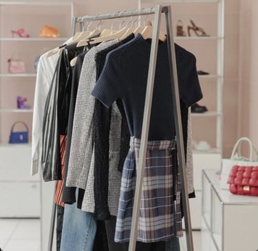 a rack of clothes hanging on a clothes rack