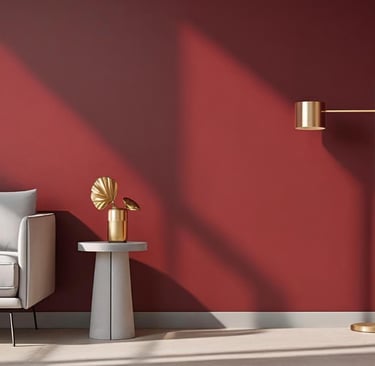 Close-up of a ruby red accent wall in a modern living room with beige sofa and brass floor lamp.
