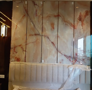 a bathroom with a marbled bathtub and a large mirror
