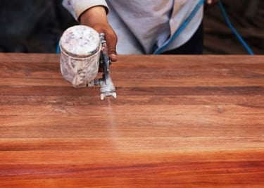 a person using a grinder on a wooden table