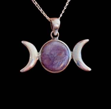 Sterling silver triple moon pendant with a purple charoite center stone